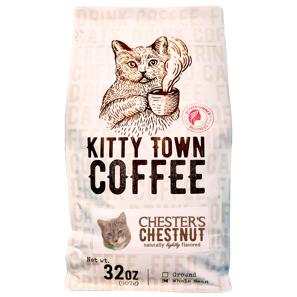 A cozy cup of Chester's Chestnut gingerbread coffee with festive decorations, evoking holiday spirit.