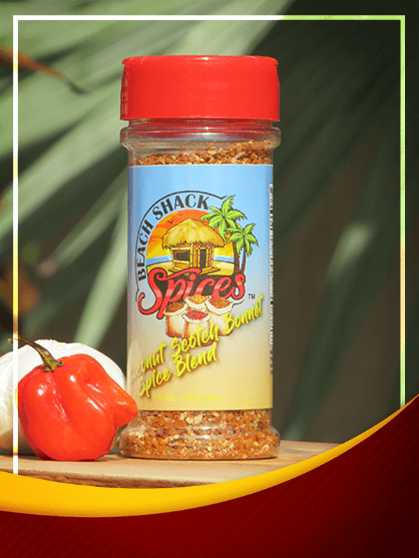A jar of Coconut Scotch Bonnet Spice Blend showcasing its vibrant color and texture, perfect for enhancing Caribbean dishes.