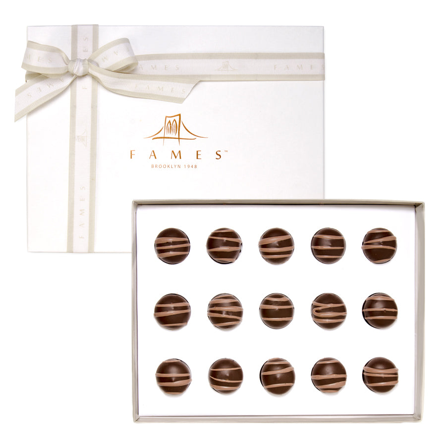 A beautifully arranged Coffee Cream Chocolate Gift Box featuring rich dark chocolate and espresso truffles with a gooey center.