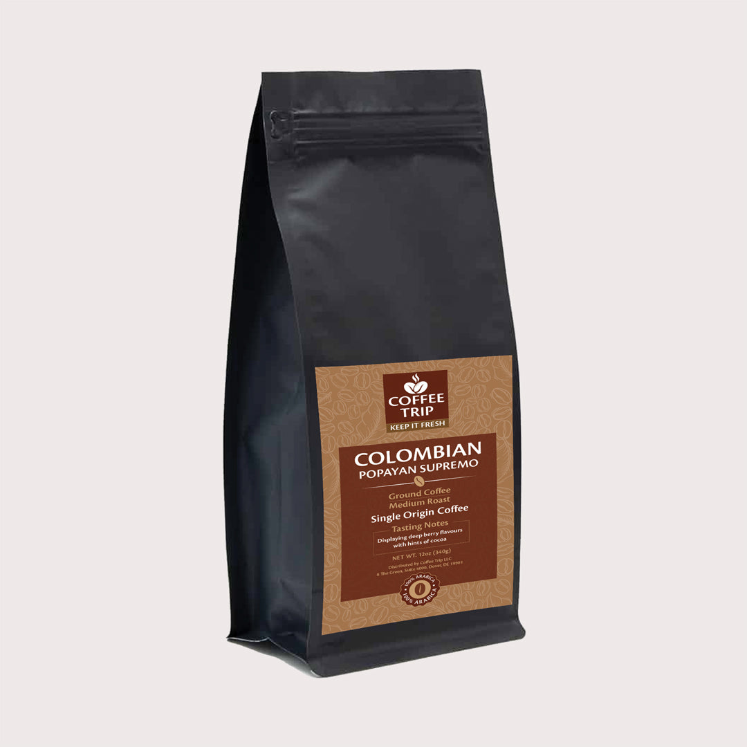 A bag of Colombian Popayan Supremo ground coffee showcasing its rich, dark color and vibrant packaging, emphasizing its premium quality.
