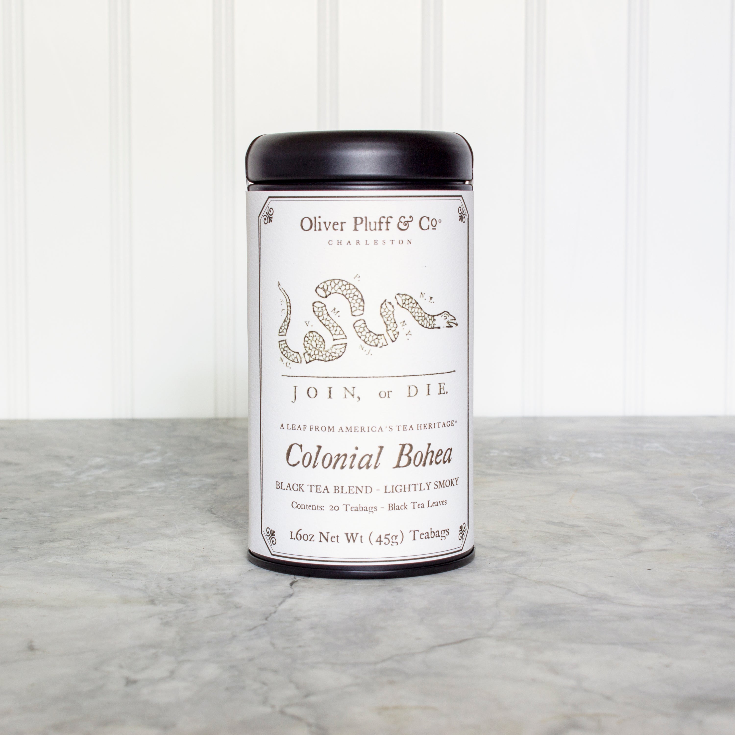 Colonial Bohea Teabags Tea Tin featuring 20 biodegradable teabags, elegantly packaged in a matte black tin.