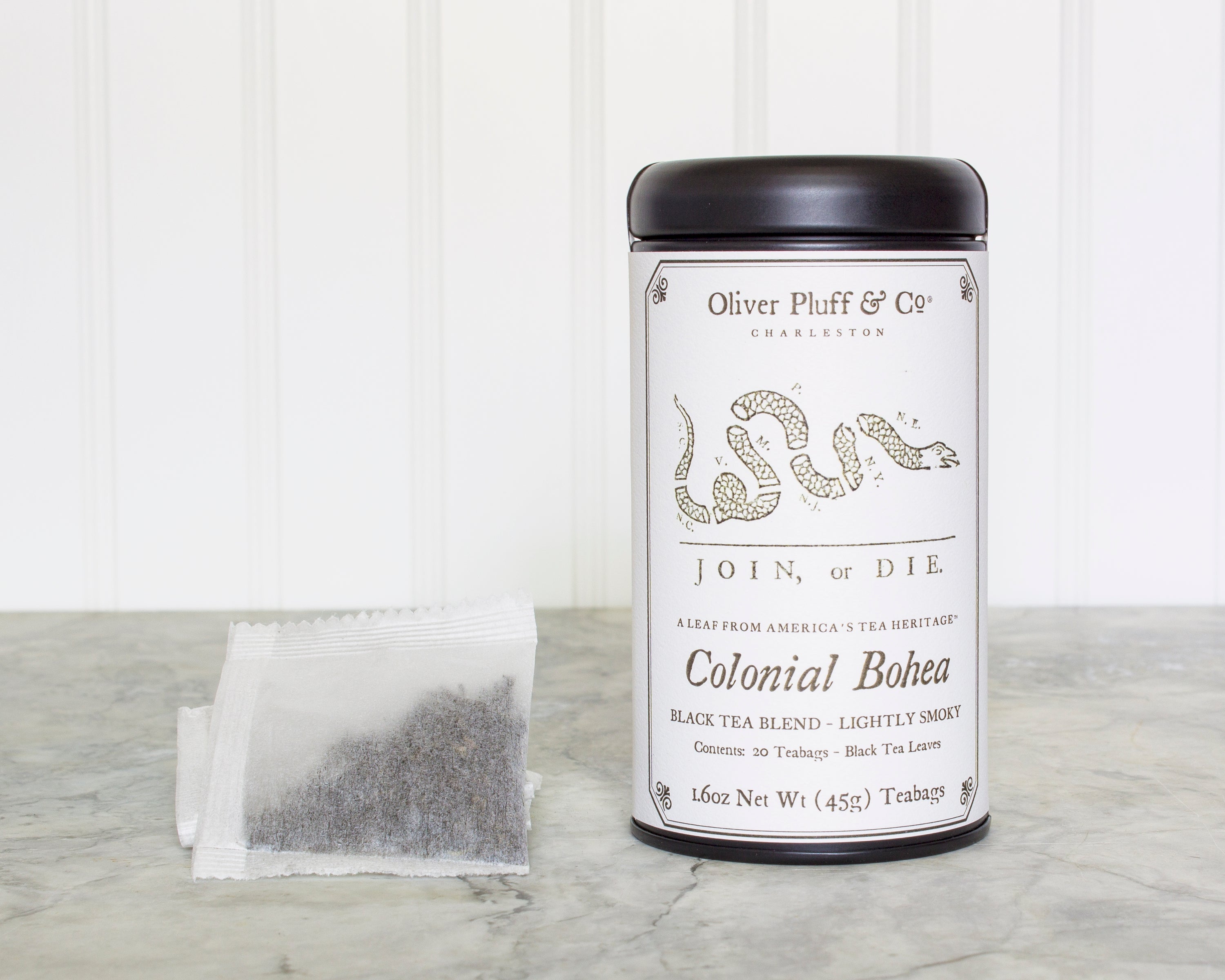 Colonial Bohea Teabags Tea Tin featuring 20 biodegradable teabags, elegantly packaged in a matte black tin.
