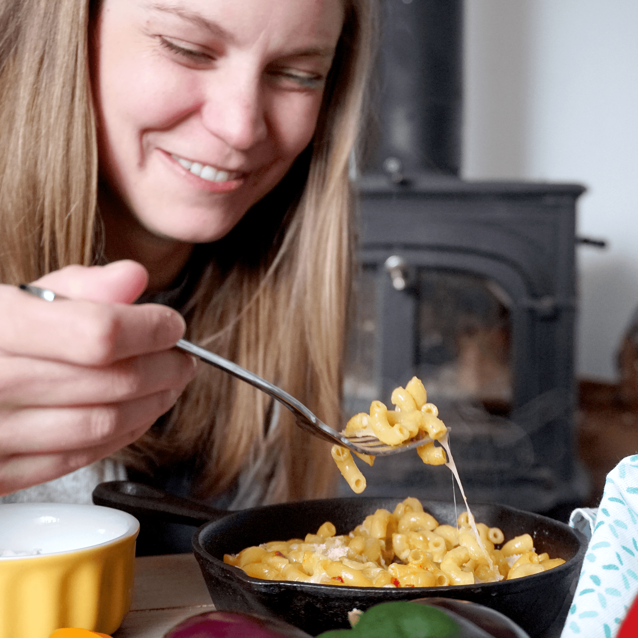 A delicious bowl of Combo Hatch Green Chile and Red Chile Cheddar Mac and Cheese, featuring vibrant colors and a creamy texture.