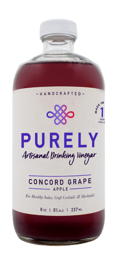 A bottle of Concord Grape Apple Infusion showcasing its vibrant color and organic ingredients.