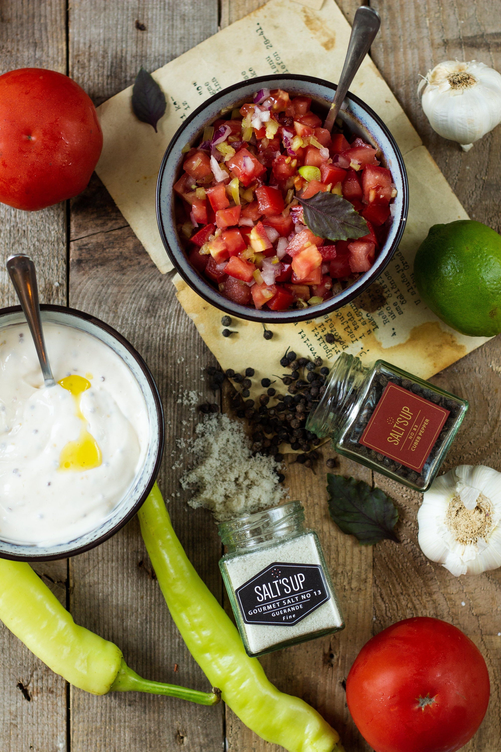 Dried CUBEB pepper berries with attached stalks, showcasing their unique appearance and color.