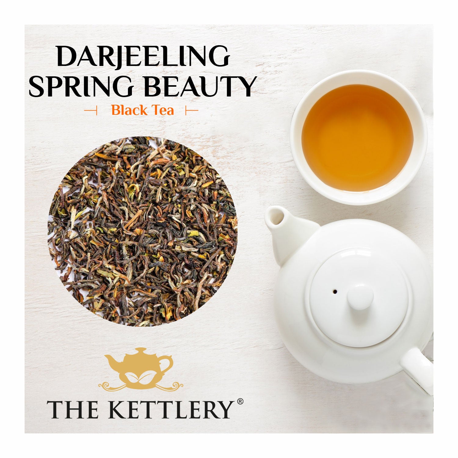 A cup of Darjeeling Spring Beauty Black Tea with fresh tea leaves and a scenic background of lush tea gardens.
