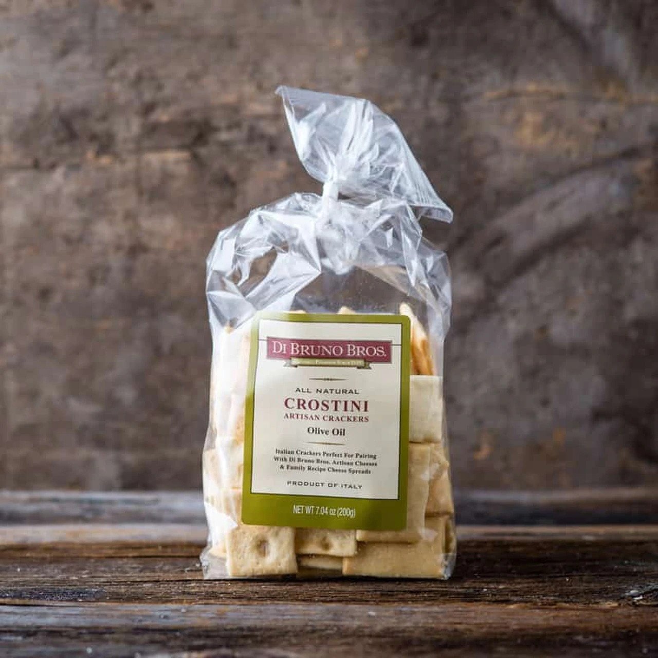 DiBruno Brothers Olive Oil Crostini in a rustic bowl, showcasing their golden-brown color and crunchy texture.