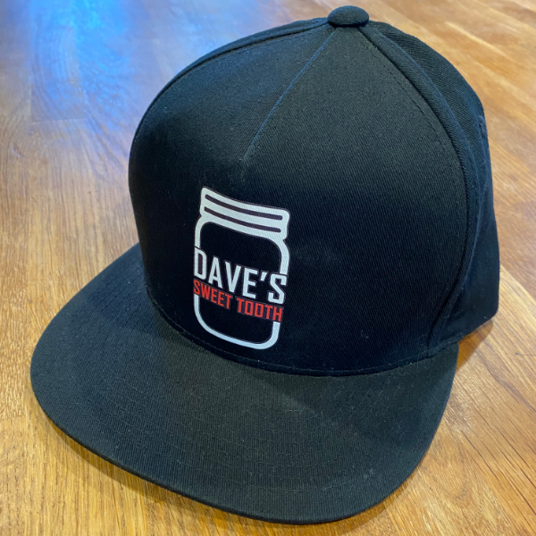 A stylish DST Snapback Hat featuring a modern design and adjustable snapback closure, perfect for casual wear.