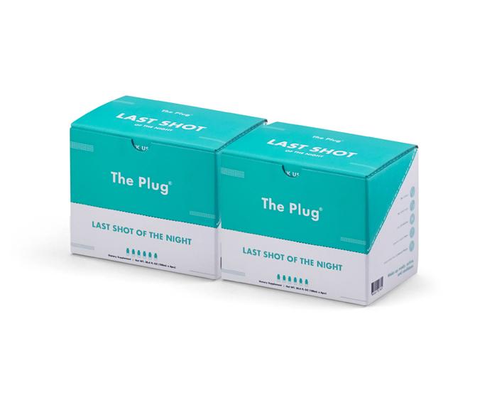 A refreshing bottle of The Plug Drink showcasing its vibrant natural ingredients and bedrock water.