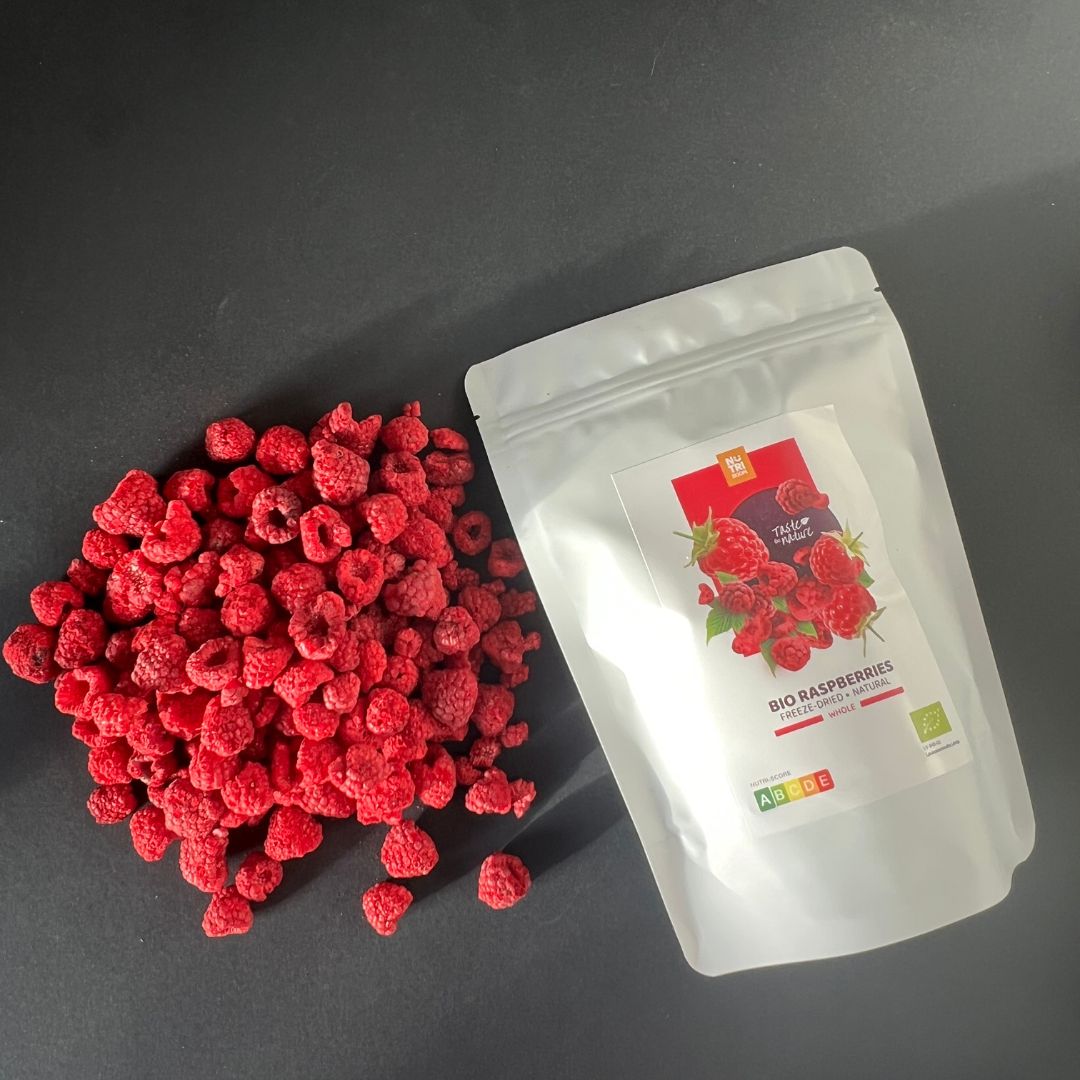 A bowl of vibrant freeze dried BIO raspberries, showcasing their rich color and texture, perfect for snacking or adding to meals.