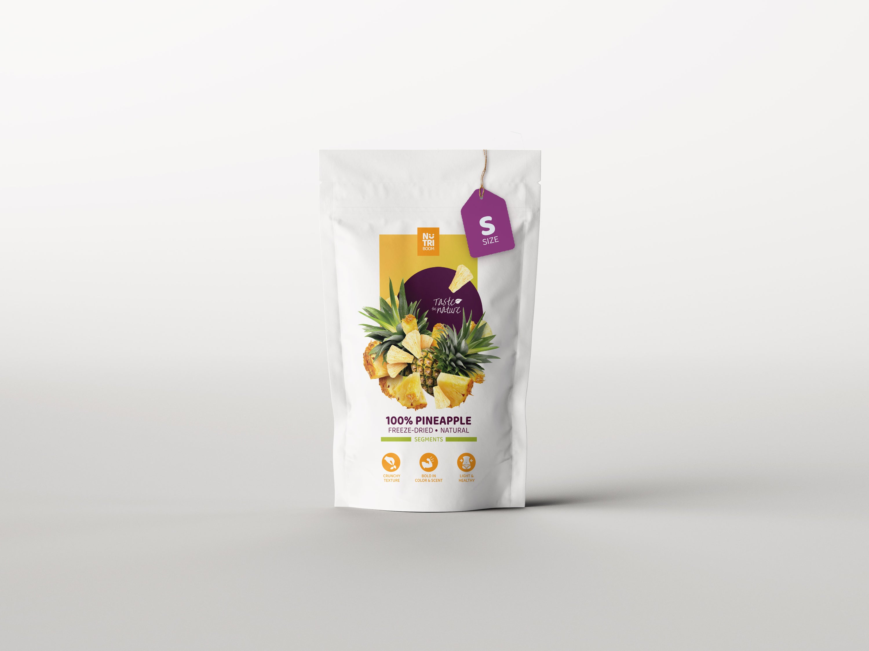 NutriBoom Freeze-dried Pineapple segments in a clear package, showcasing their vibrant color and texture.