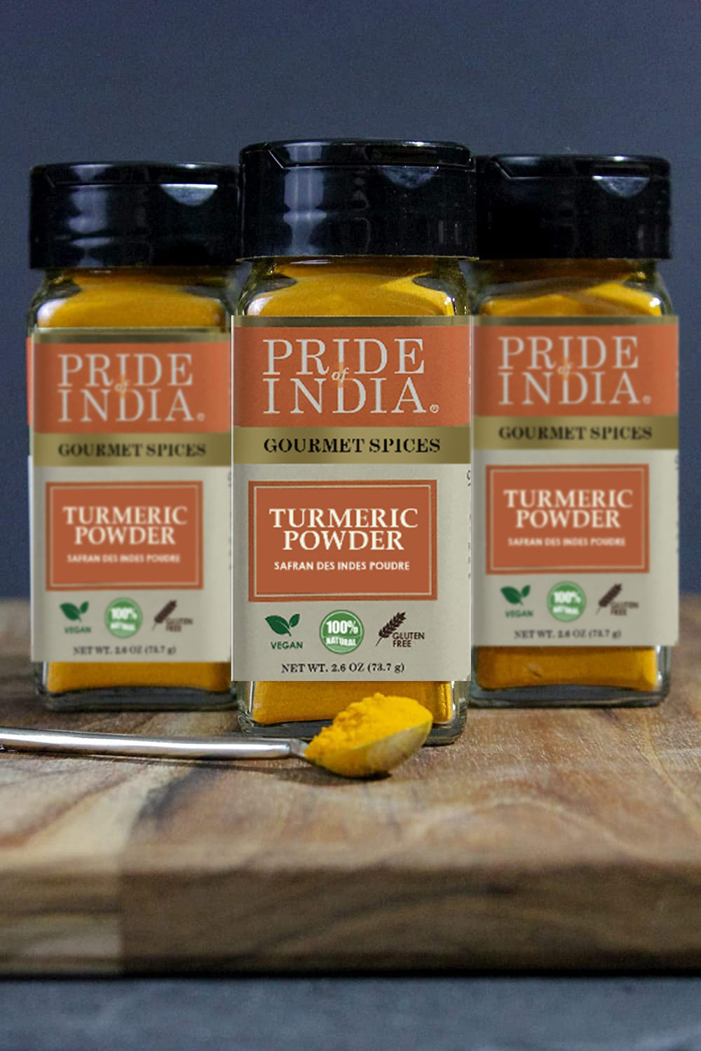 A jar of Pride of India Gourmet Turmeric Ground showcasing its vibrant yellow color, symbolizing purity and high curcumin content.