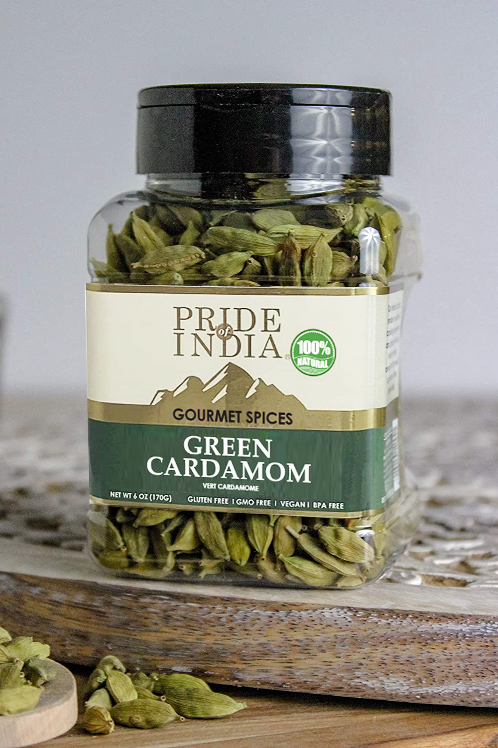 A 6 oz package of whole green cardamom pods, showcasing their vibrant green color and unique shape, perfect for culinary use.