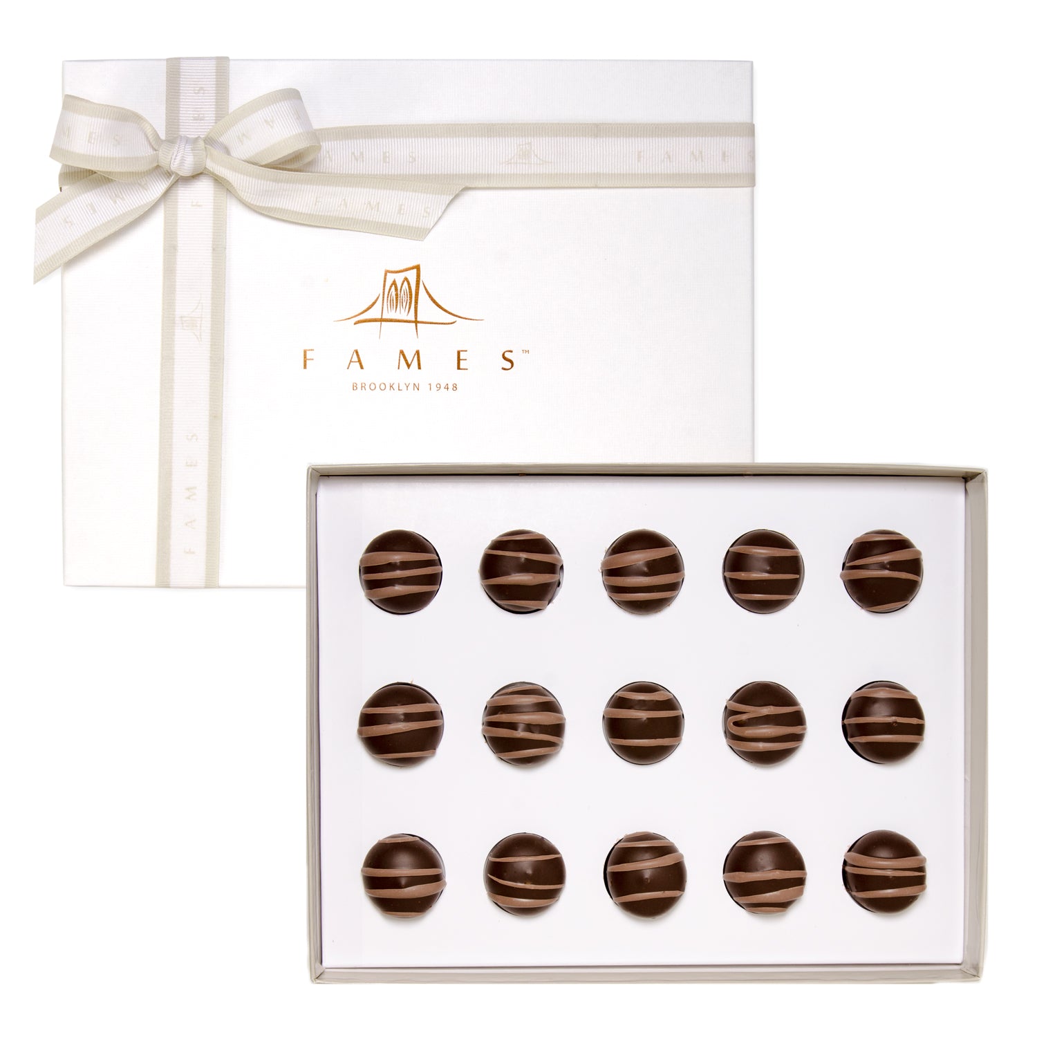 A beautifully arranged Hazelnut Truffle Chocolate Gift Box featuring rich dark chocolate truffles with creamy praline and roasted hazelnuts.