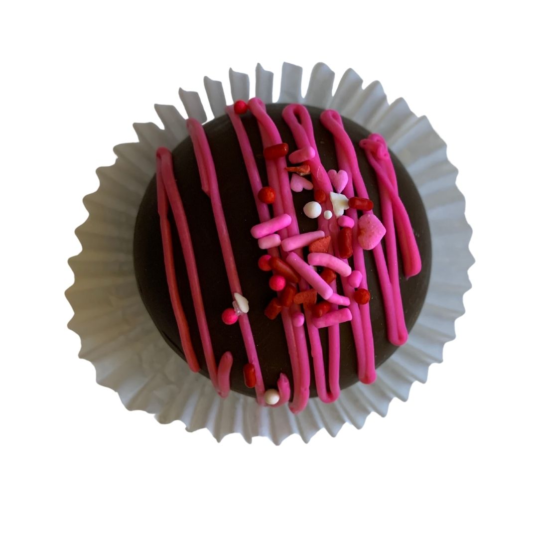 A beautifully arranged set of Hot Chocolate Bombs filled with marshmallows, perfect for Valentine's Day gifting, showcasing their rich chocolate exterior.