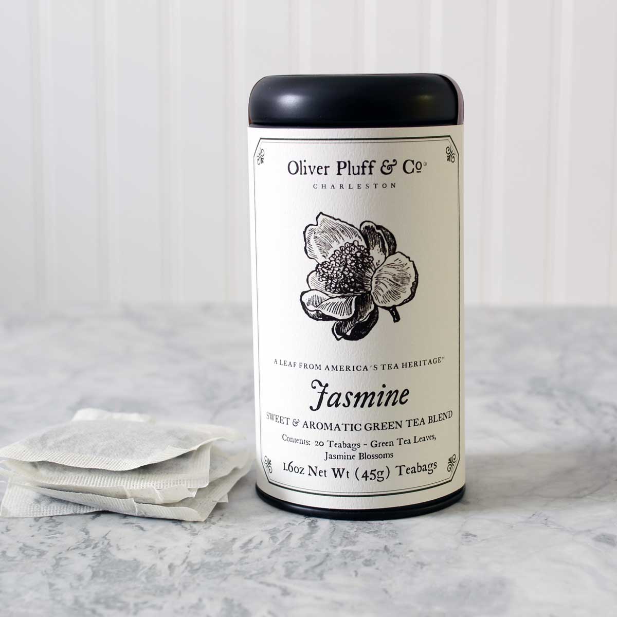 Jasmine Teabags Tea Tin featuring 20 pillow sachet teabags with jasmine blossoms and green tea.