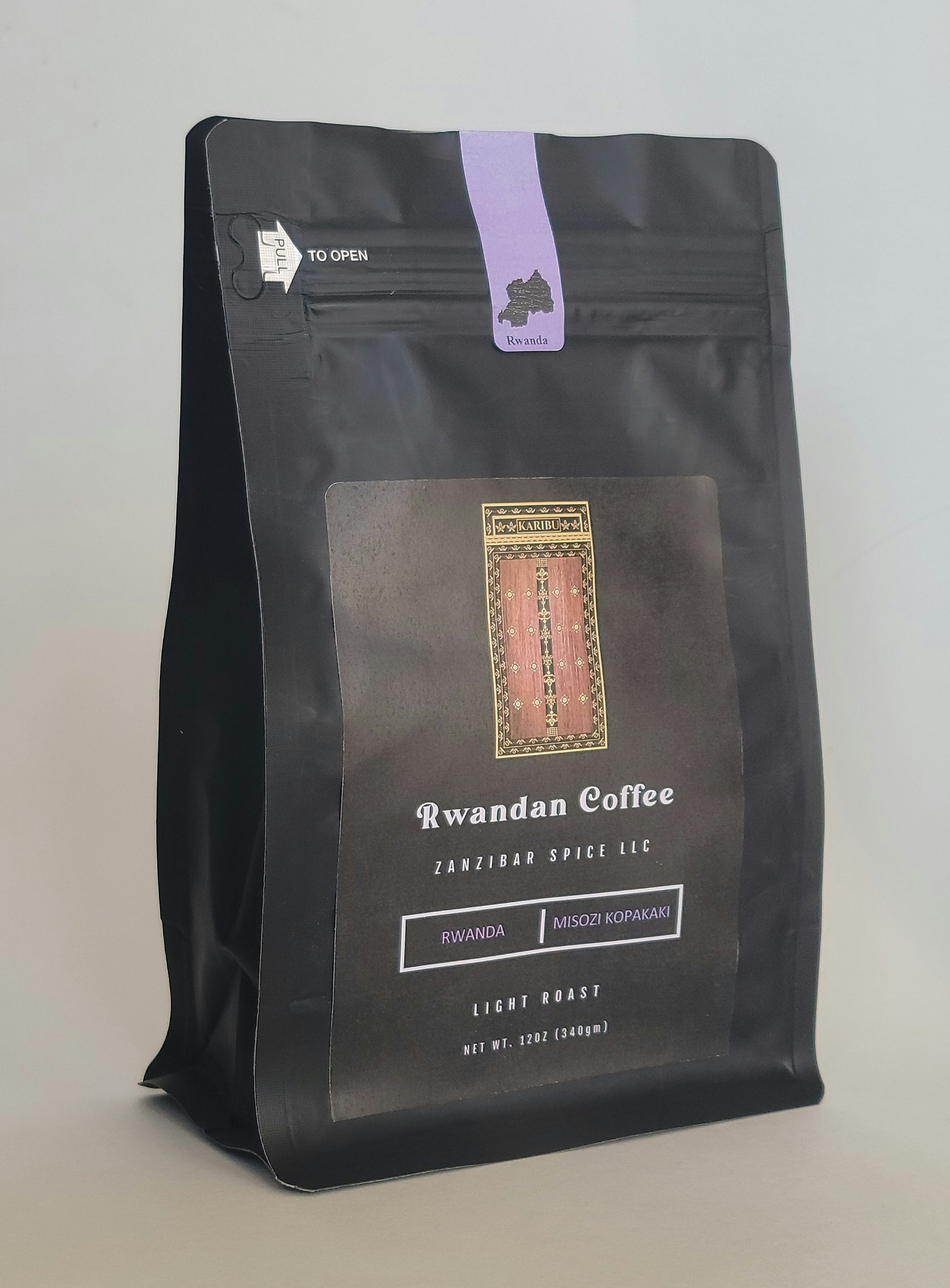 A 12oz resealable bag of Light Roast Rwanda Plain Coffee showcasing its rich aroma and vibrant packaging.