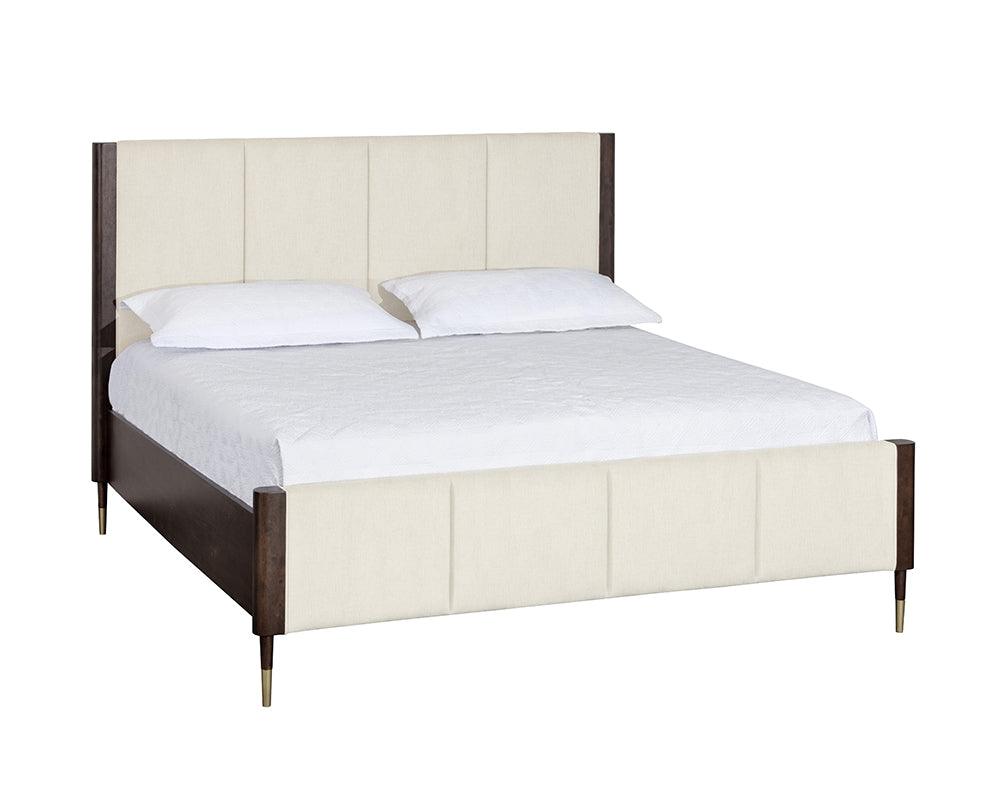Lonnie Bed in King size featuring polo club muslin fabric with vertical channel tufting and brass metal footcaps.