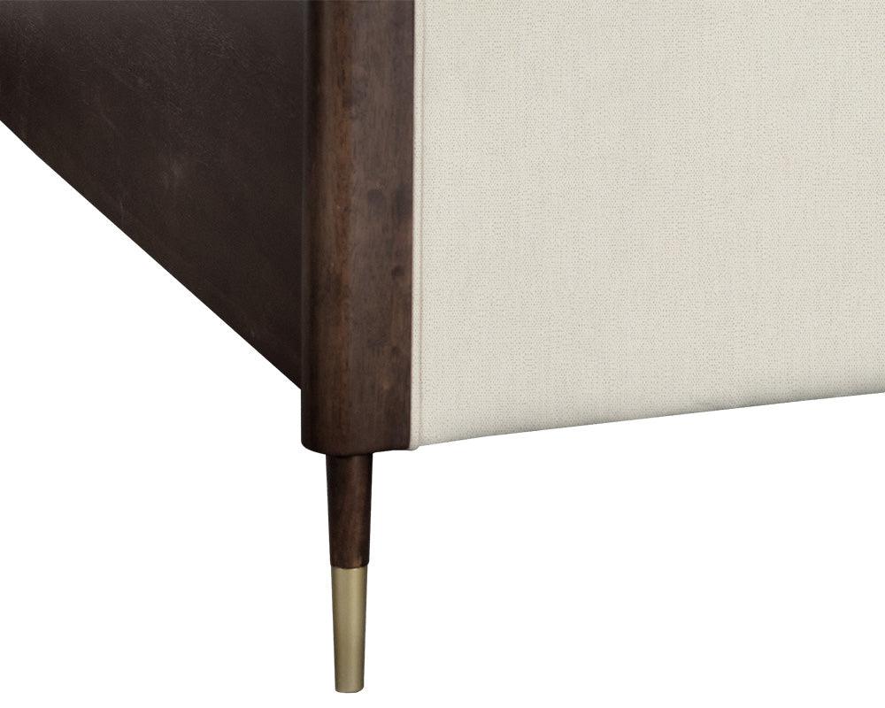Lonnie Bed in King size featuring polo club muslin fabric with vertical channel tufting and brass metal footcaps.