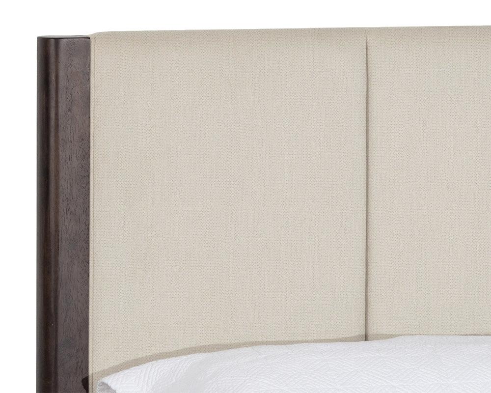 Lonnie Bed in King size featuring polo club muslin fabric with vertical channel tufting and brass metal footcaps.