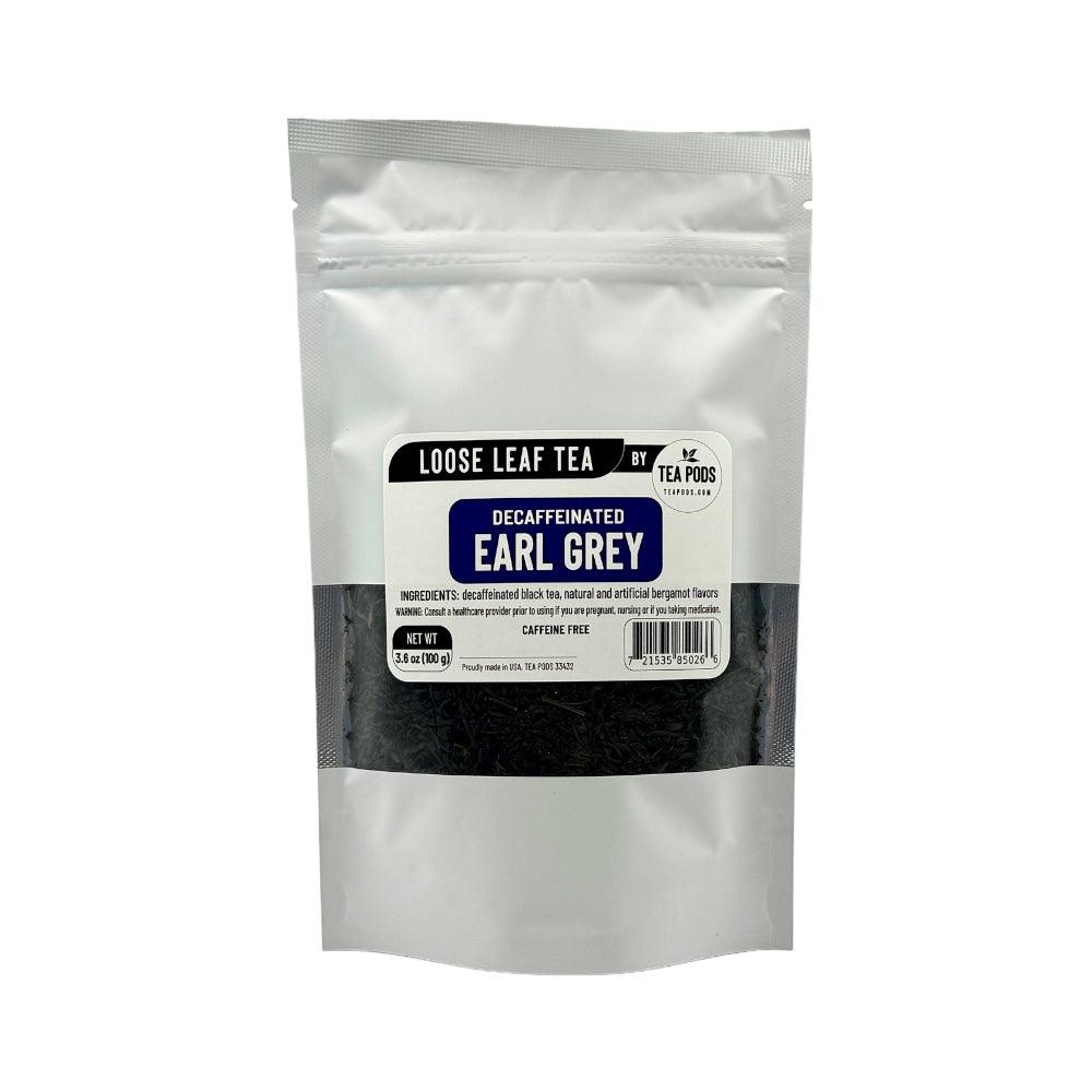 A close-up of Loose Leaf Decaffeinated Earl Grey black tea with dry tea leaves and bergamot flavoring, showcasing its rich texture and aroma.