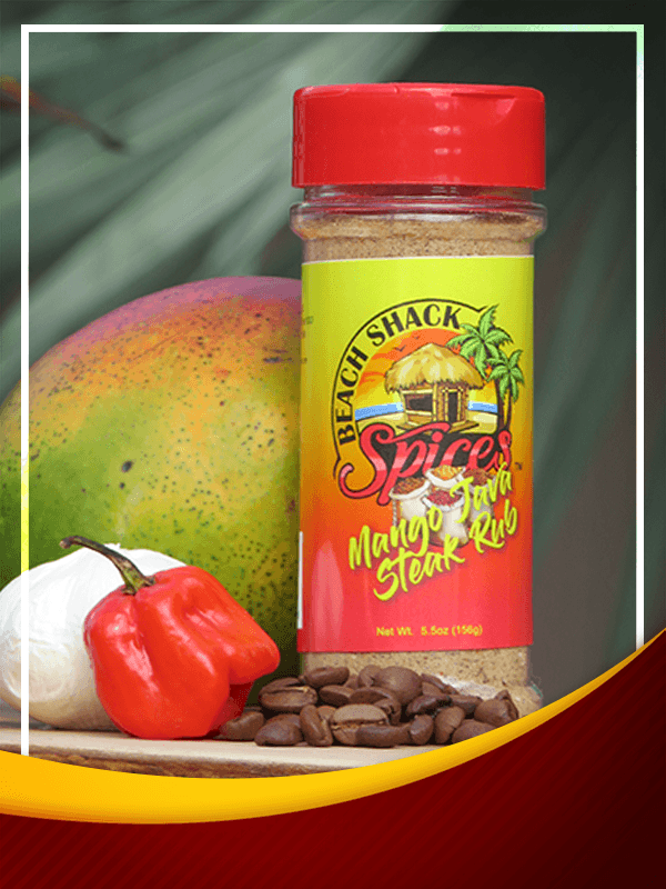 A jar of Mango Java Steak Rub with vibrant spices and herbs, perfect for enhancing steak flavor.