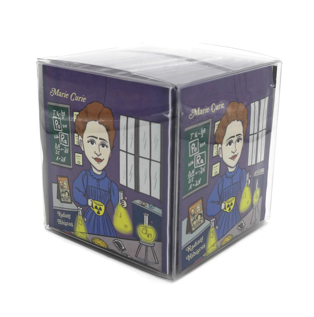 A vibrant package of Marie Curie Radiant Hibiscus tea featuring organic ingredients and an artistic wrapper design by Chari Pere.