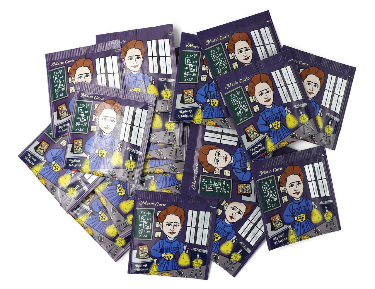 A vibrant package of Marie Curie Radiant Hibiscus tea featuring organic ingredients and an artistic wrapper design by Chari Pere.