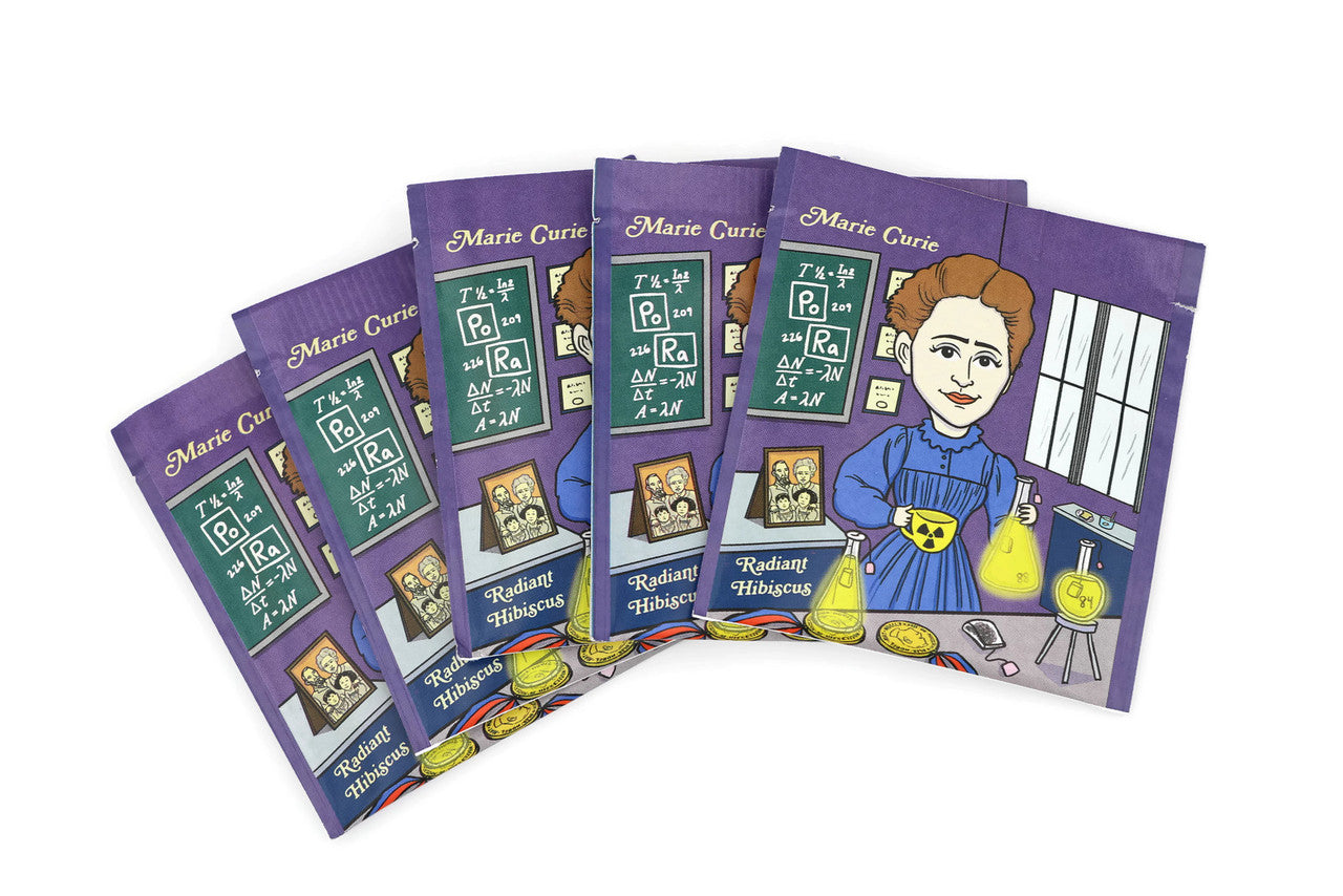 A vibrant package of Marie Curie Radiant Hibiscus tea featuring organic ingredients and an artistic wrapper design by Chari Pere.