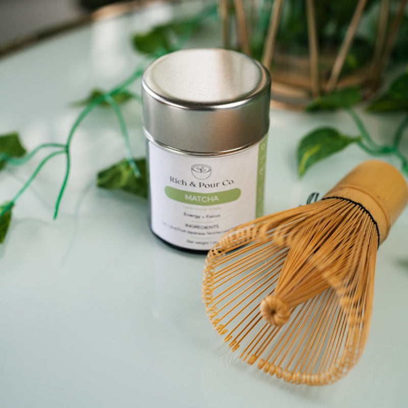 A traditional 84 prong bamboo chasen whisk for preparing matcha, showcasing its fine prongs and natural bamboo texture.