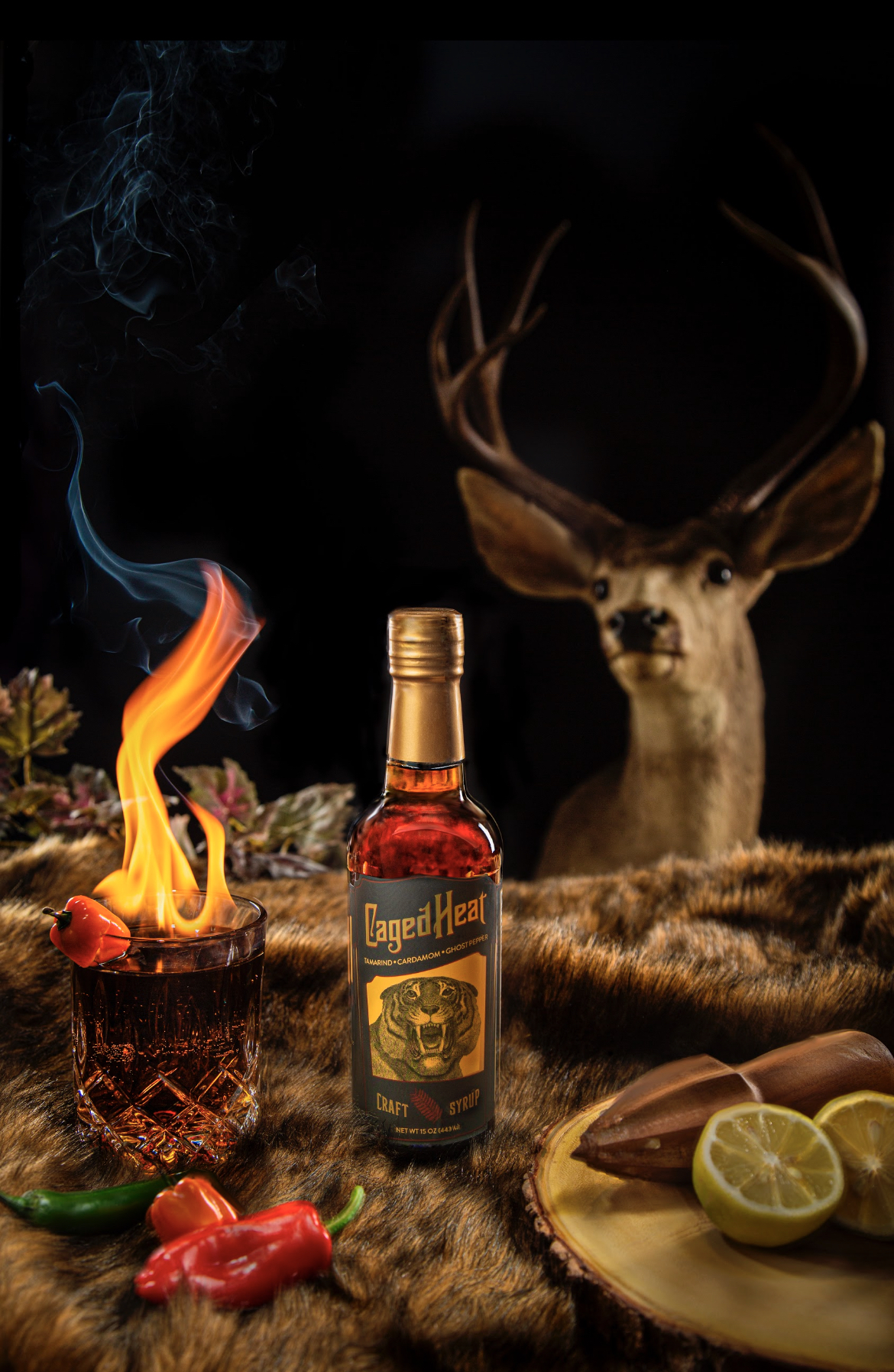 Caged Heat cocktail syrup featuring tamarind, cardamom, and ghost pepper in elegant glass bottles.