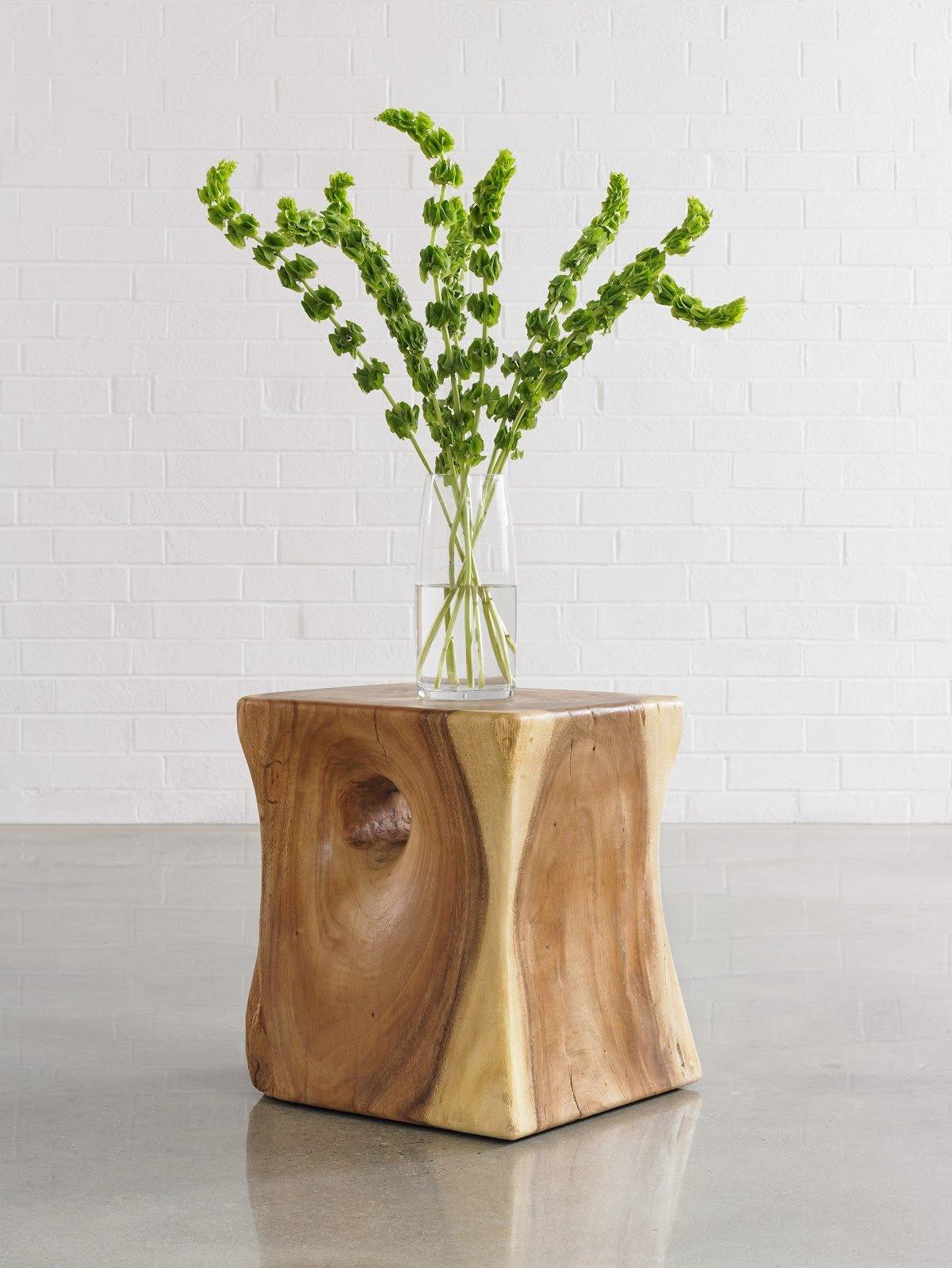 Peek a Boo Side Table made of natural chamcha wood with a decorative hole and organic edges, showcasing its unique design and brown finish.