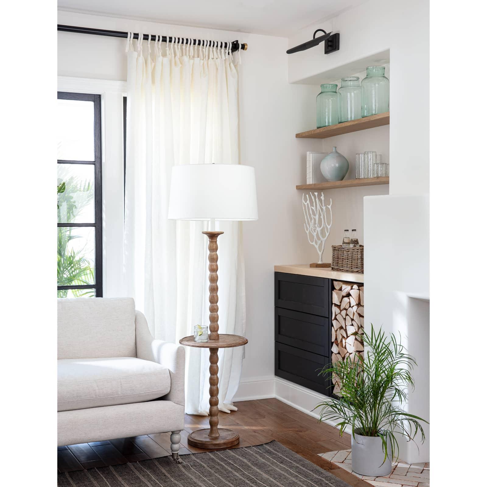 Elegant Perennial Floor Lamp made from solid birch wood with a rustic finish, featuring a functional tabletop and a stylish shade.