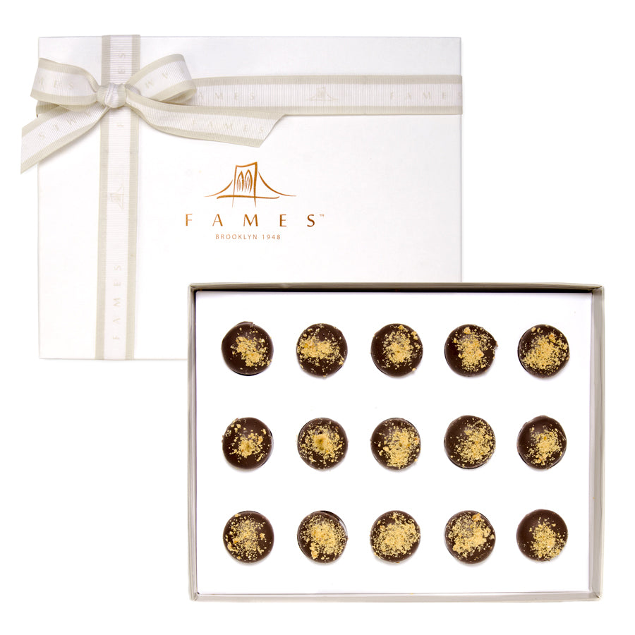 Rum Royale Chocolate Gift Box featuring dark chocolate truffles with creamy nougat and crushed nuts.