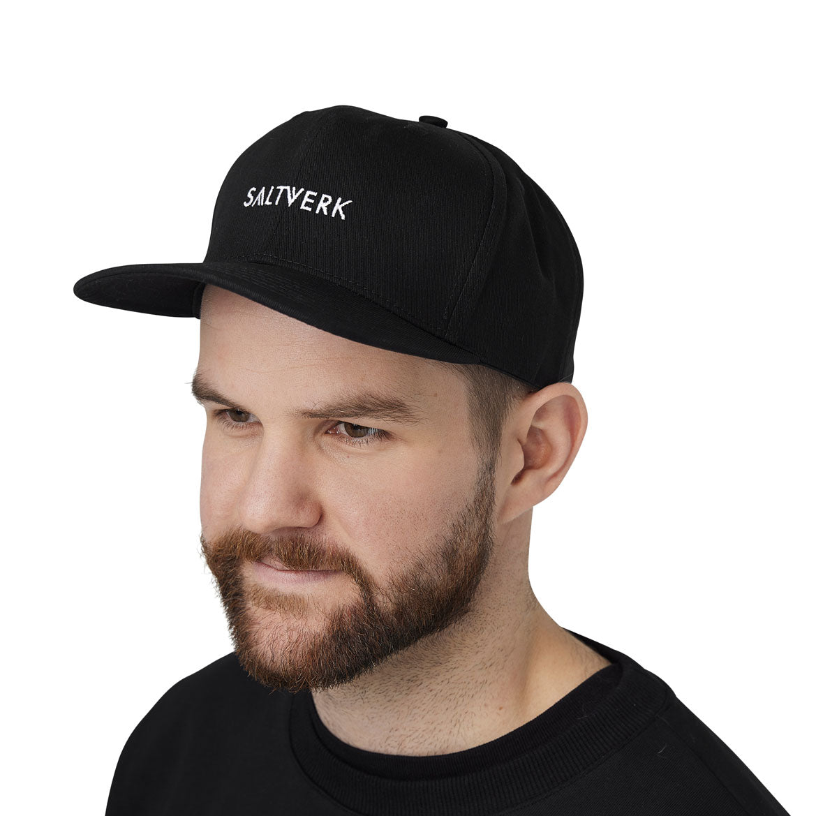 SALTVERK Black Snapback Cap with embroidered logo, stylish and versatile for casual wear.