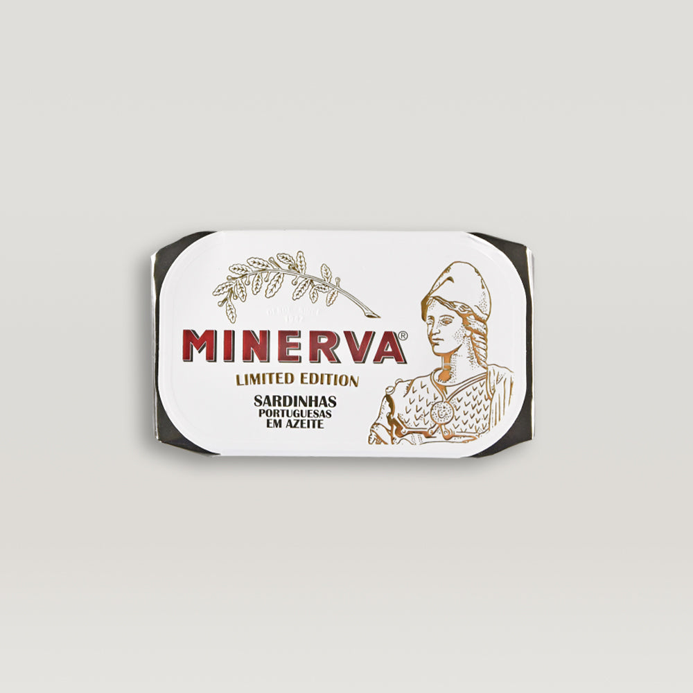 A can of Limited Edition Sardines in Olive Oil, showcasing the premium quality and traditional packaging, with a backdrop of olive oil and herbs.
