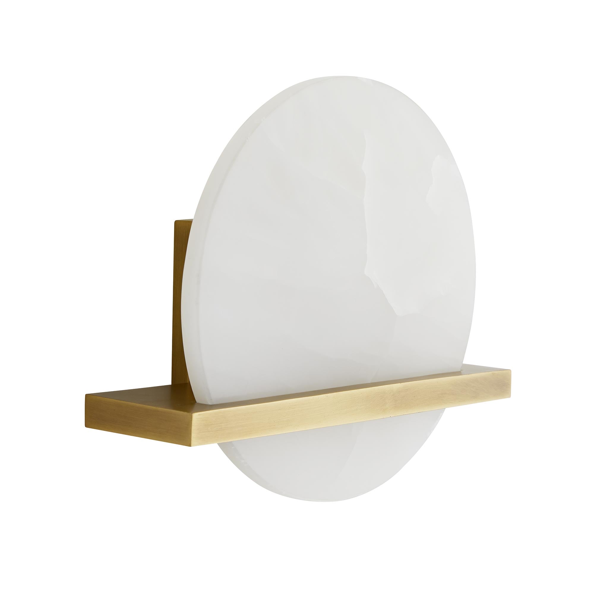 Savian Sconce featuring polished white onyx and antique brass frame, illuminating a stylish interior space.