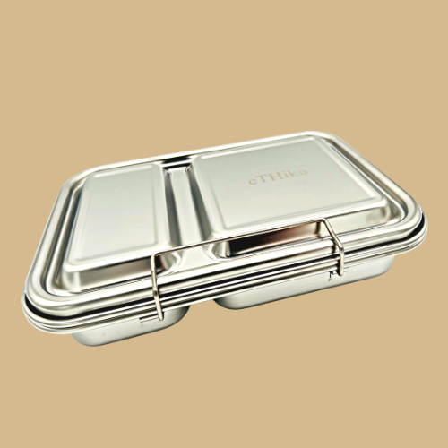 SMART LUNCHBOX with two compartments, made of stainless steel, showcasing its sleek design and silicone lid.