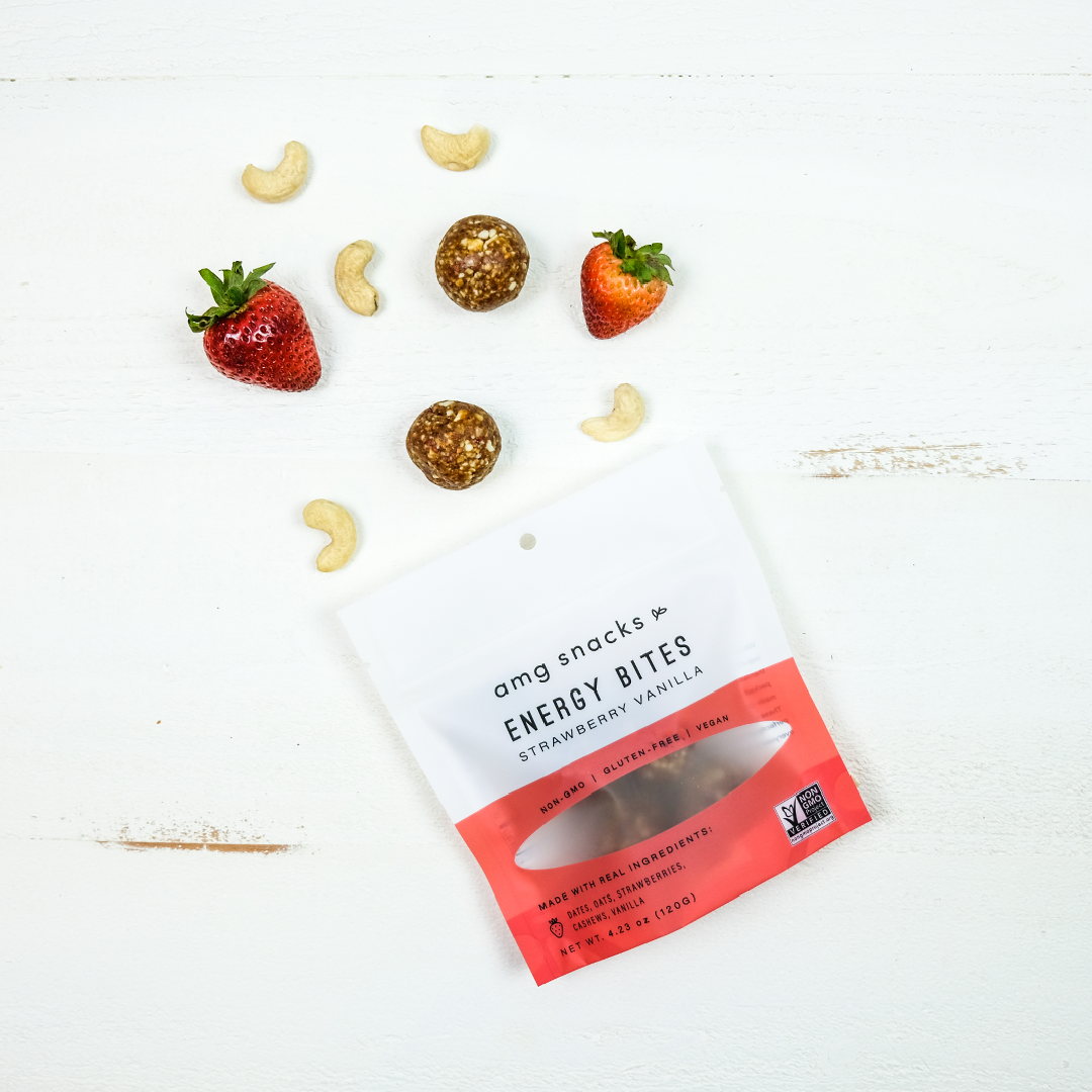 A bag of Strawberry Vanilla Energy Bites showcasing the healthy snack with visible strawberries and oats.