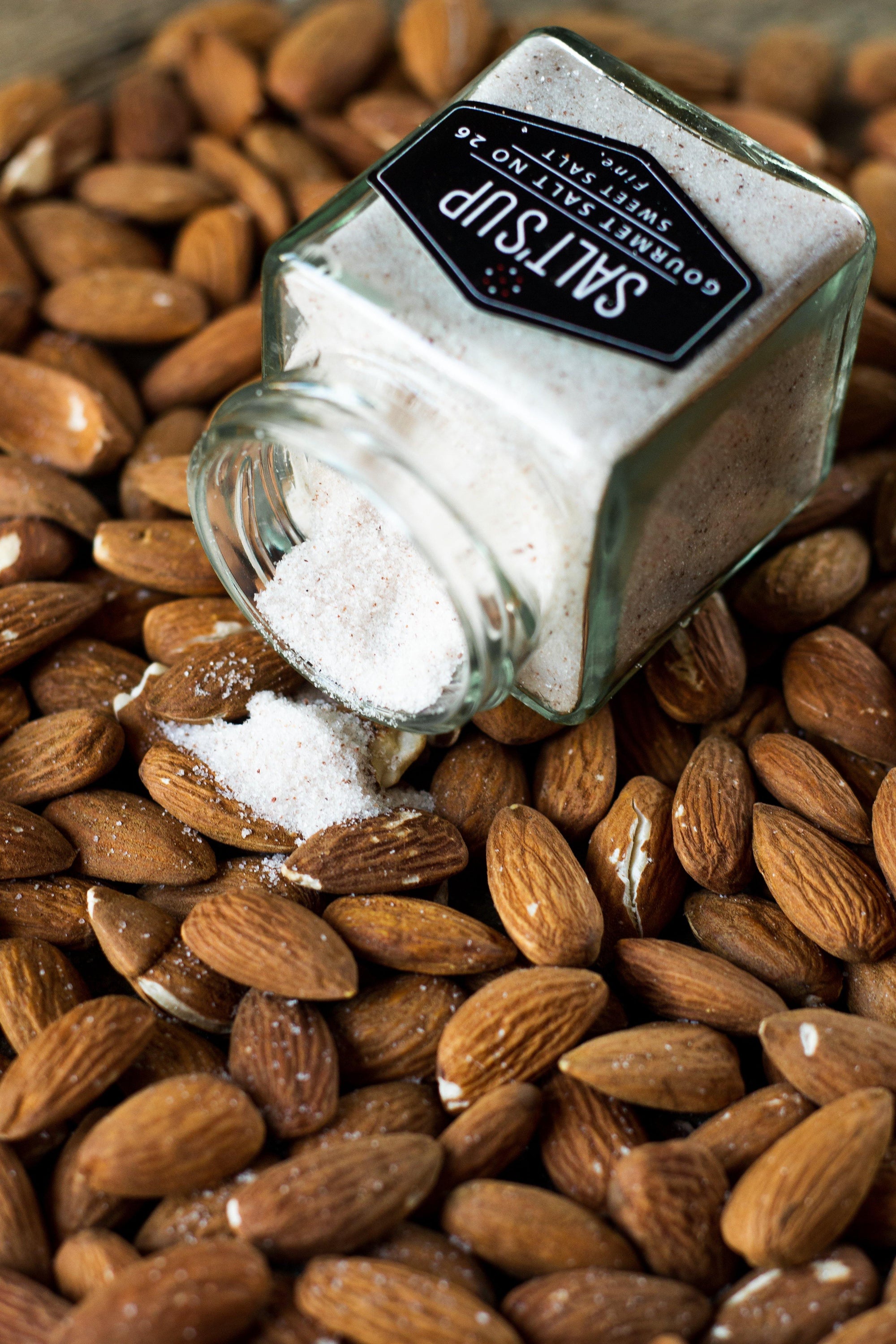A jar of SWEET SALT fine, a mineral-rich seasoning salt from North America, showcasing its fine texture and packaging.