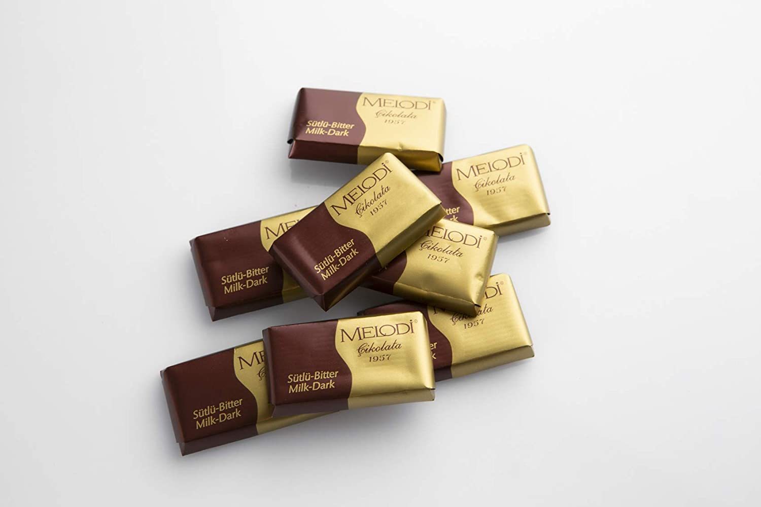 A box of 65 Wrapped Chocolate Truffles, individually wrapped in elegant packaging, showcasing creamy milk chocolate treats.