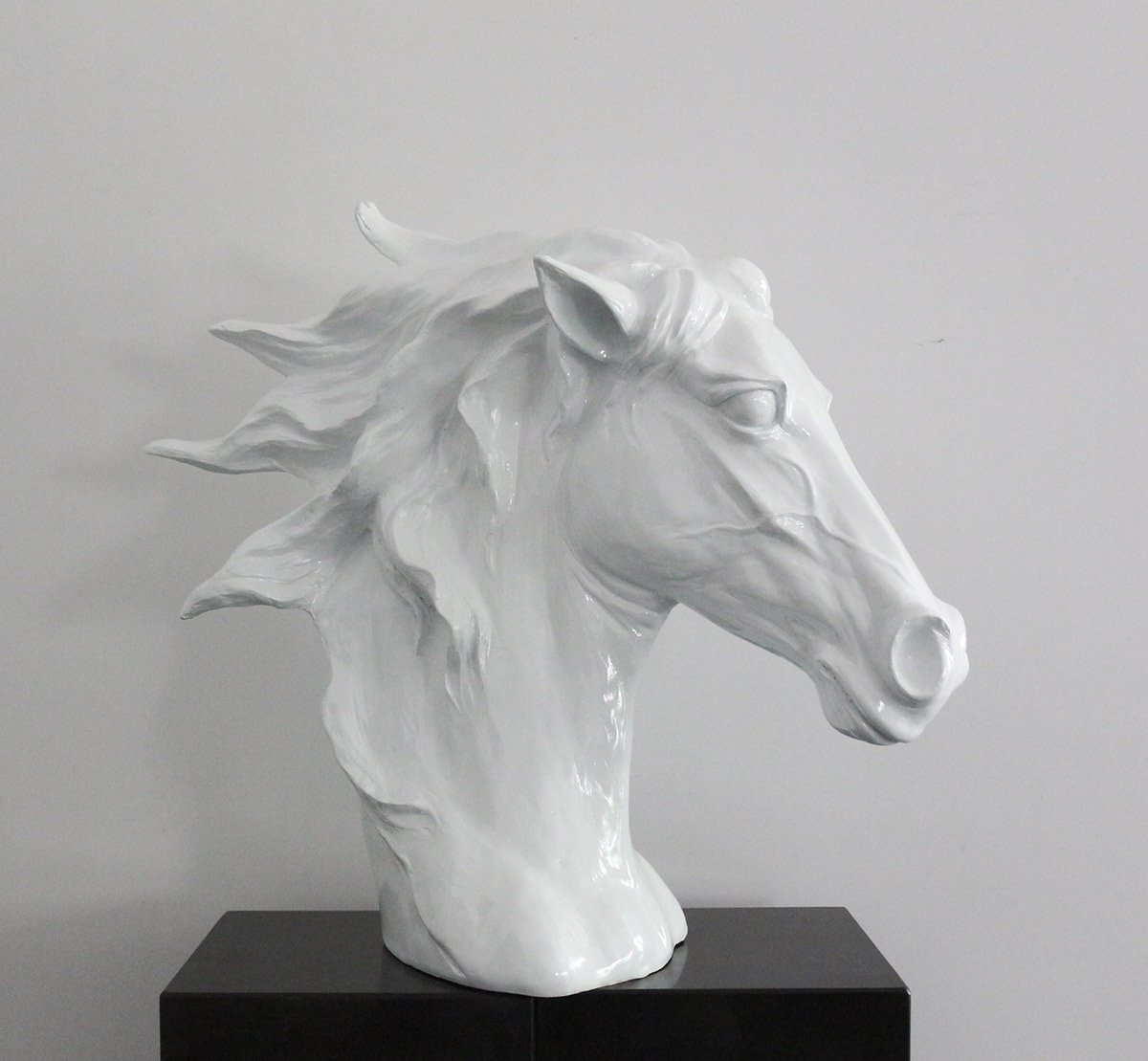 An elegant 11-inch white polyresin horse head sculpture, showcasing intricate details and a contemporary design, perfect for home decor.