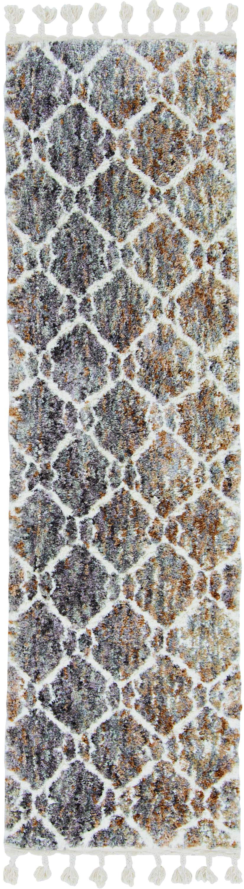 A large 105" X 156" polyester rug in grey and sand colors, featuring a cozy boho design with fringe detailing, perfect for enhancing living spaces.