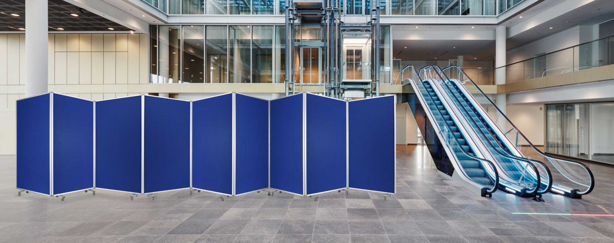 A stylish blue metal and fabric screen room divider with three panels, featuring sturdy wheels for mobility and a modern design.