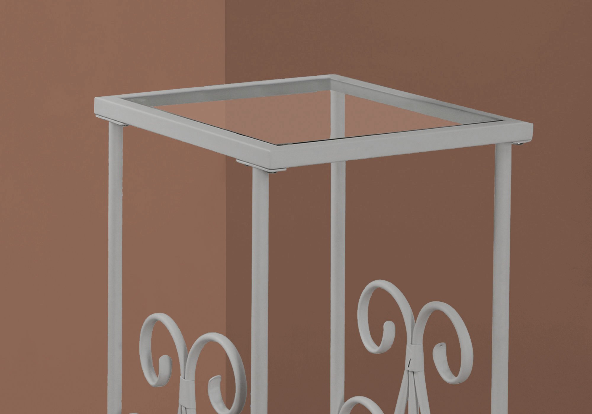 A stylish 12" x 16" x 30" white clear metal tempered glass accent table, showcasing its sleek design and elegant finish.