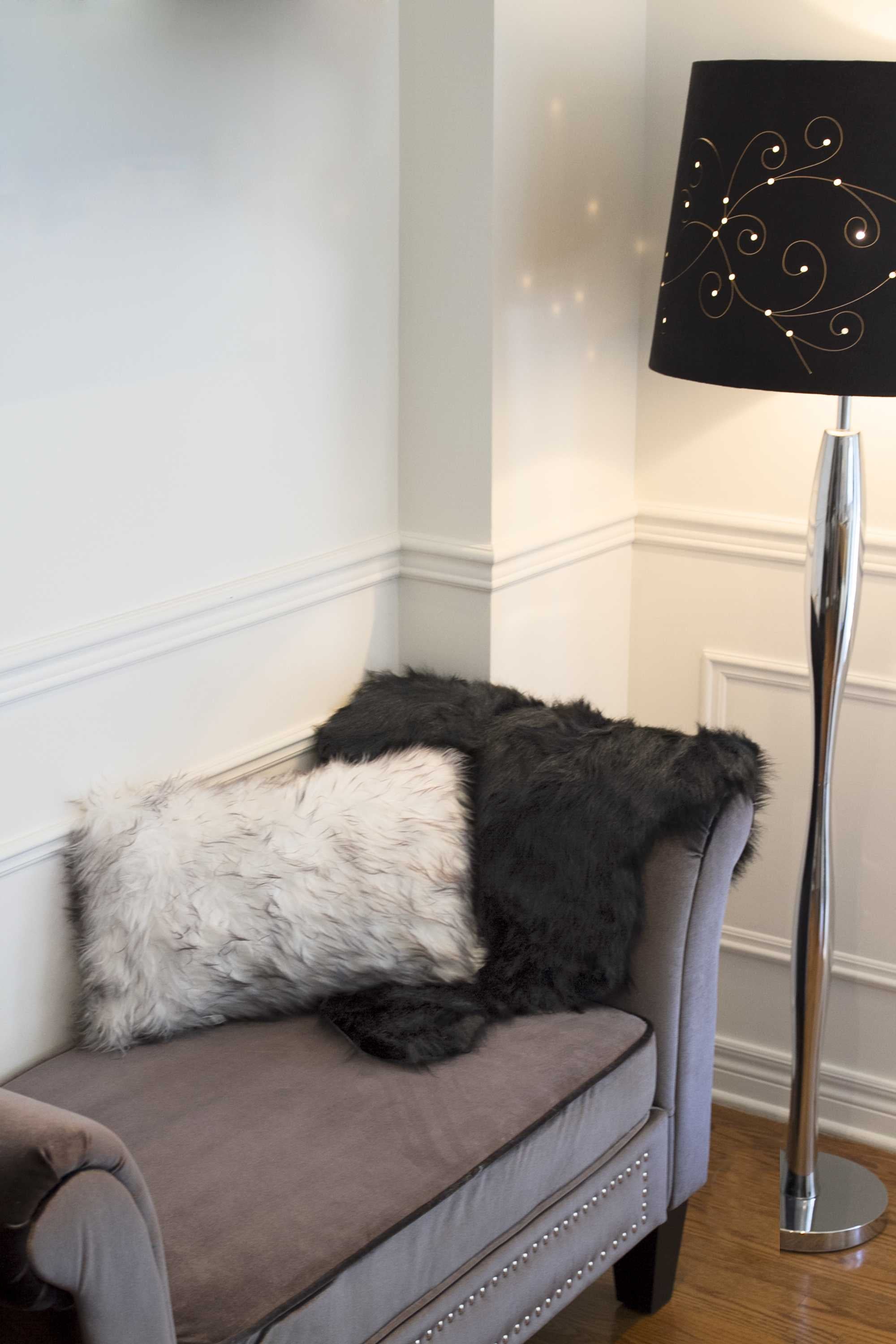 Two luxurious gradient gray faux fur pillows, showcasing a plush texture and elegant design, perfect for home decor.