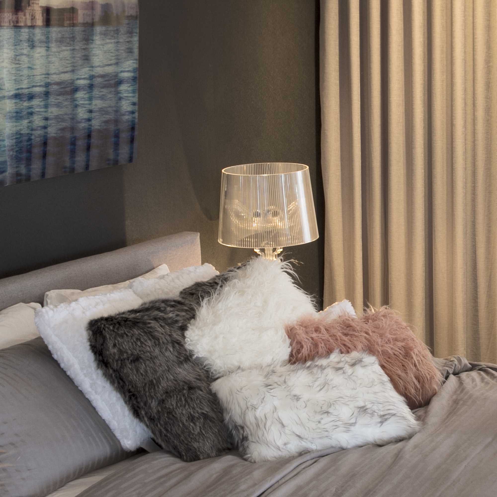 Two luxurious gradient gray faux fur pillows, showcasing a plush texture and elegant design, perfect for home decor.