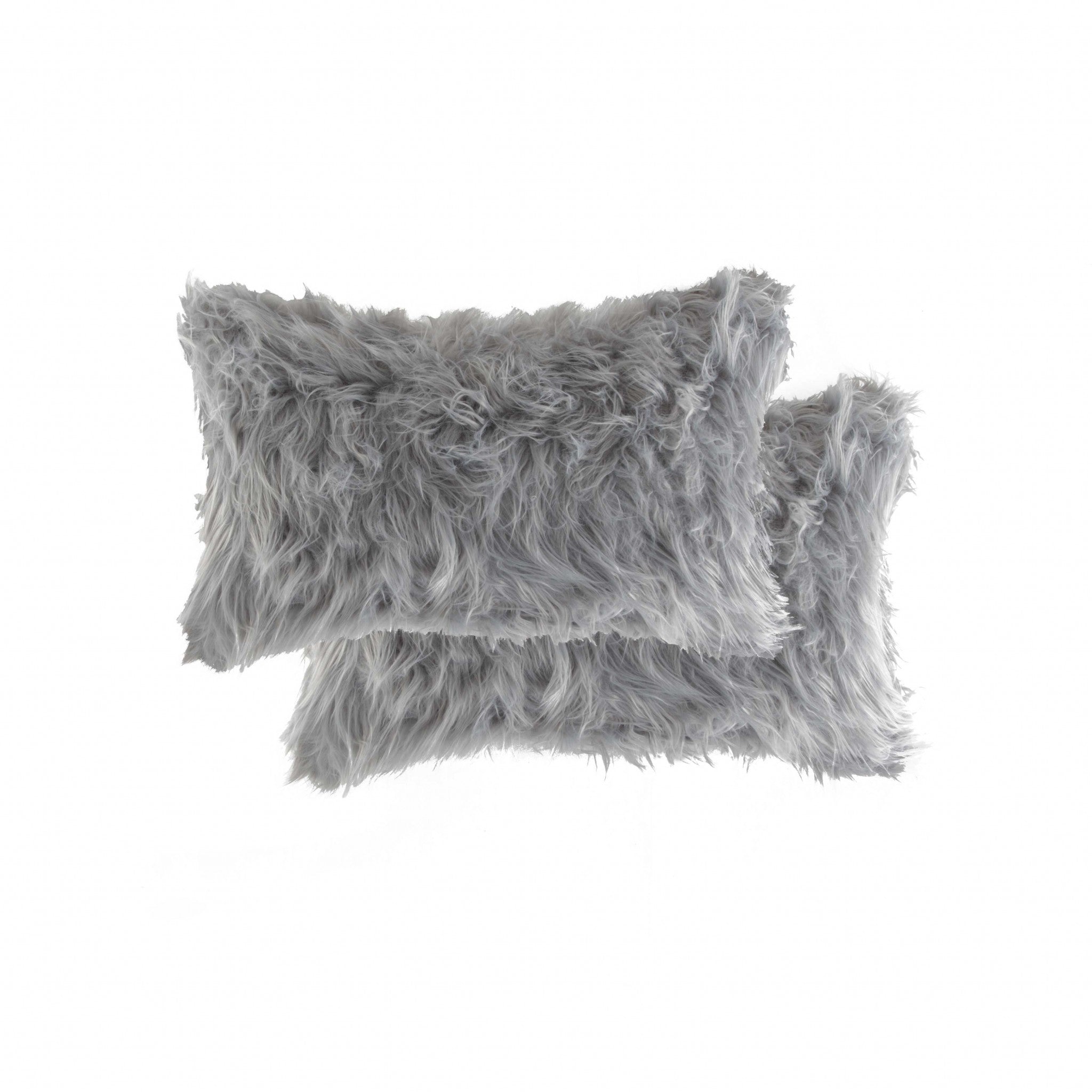 Two luxurious gray faux fur pillows, measuring 12x20 inches, showcasing a plush and soft texture, perfect for home decor.