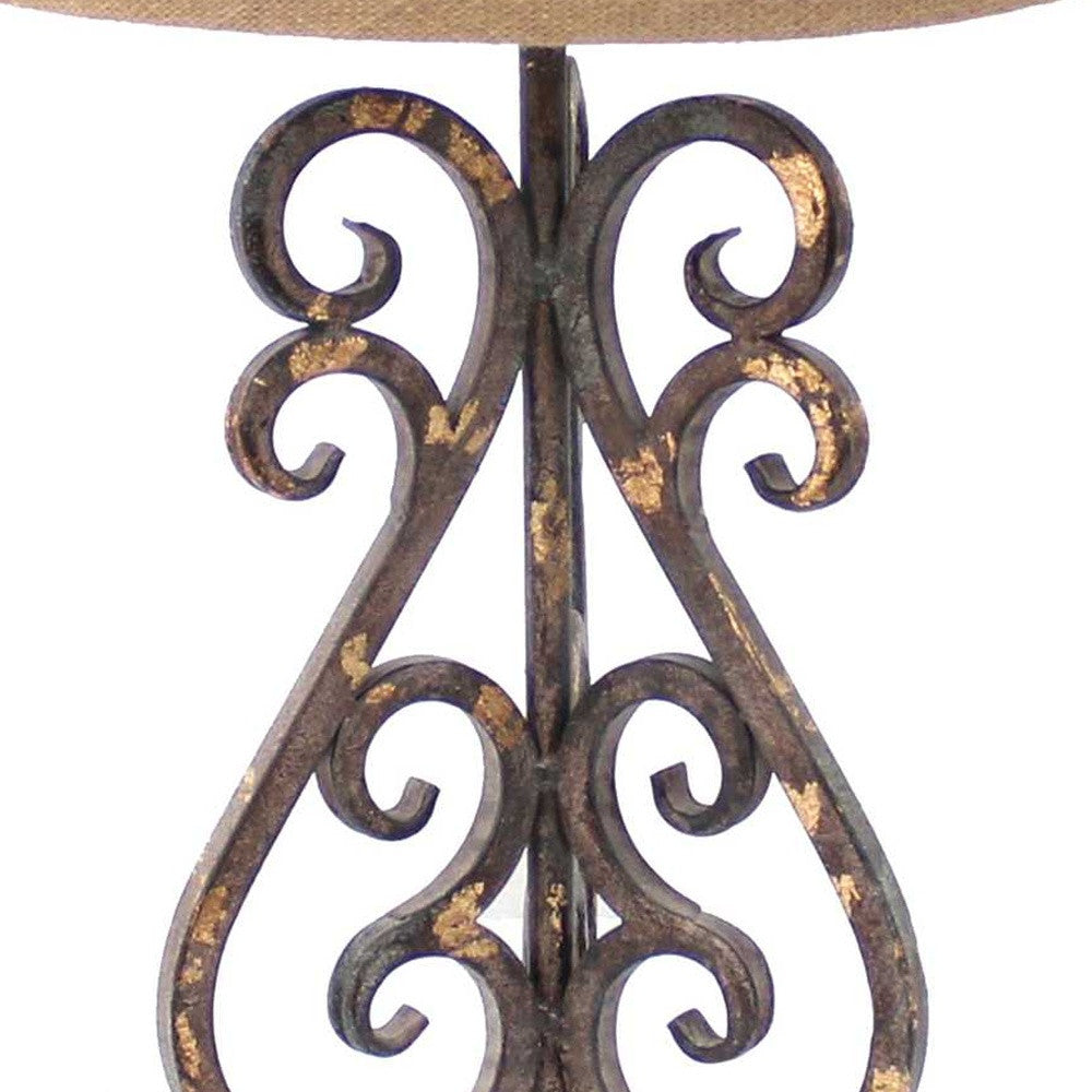 Bronze vintage metal table lamp with khaki linen shade and floral base, perfect for home decor.
