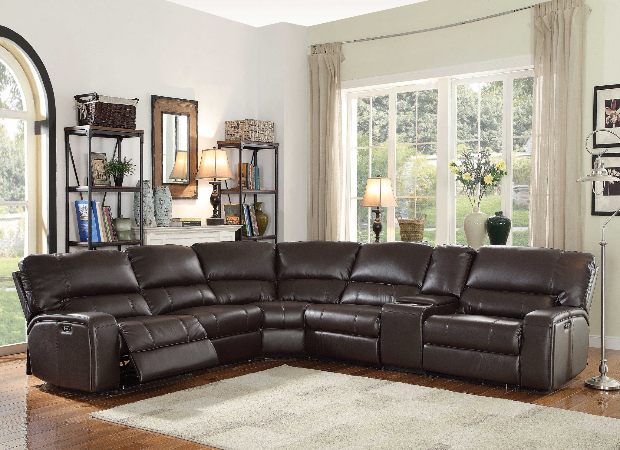 A luxurious black leather-aire motion sofa with plush cushions and USB docks on both sides, designed for modern living rooms.